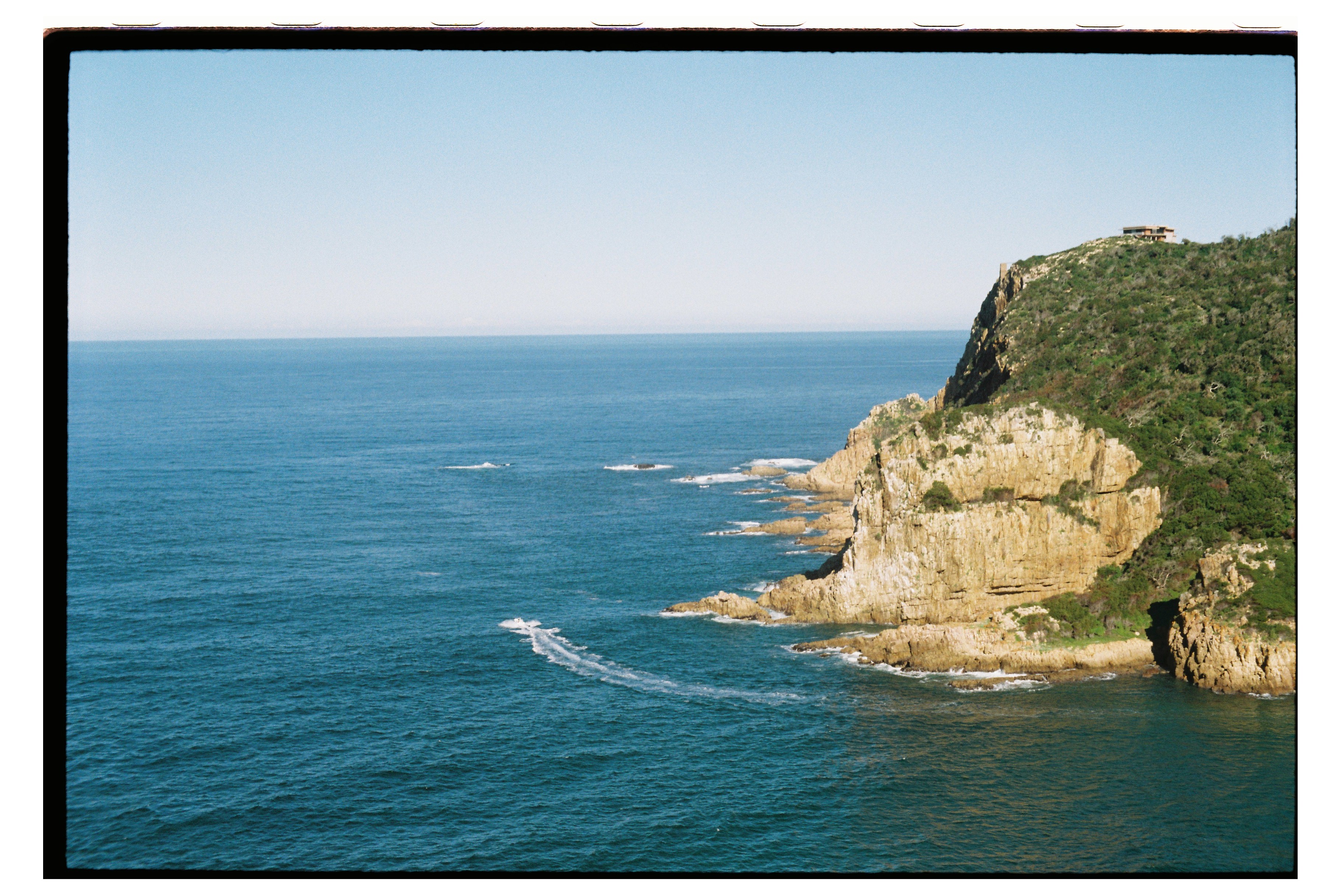 Ocean view from the Eastern Head, Knysna. Boat in frame.