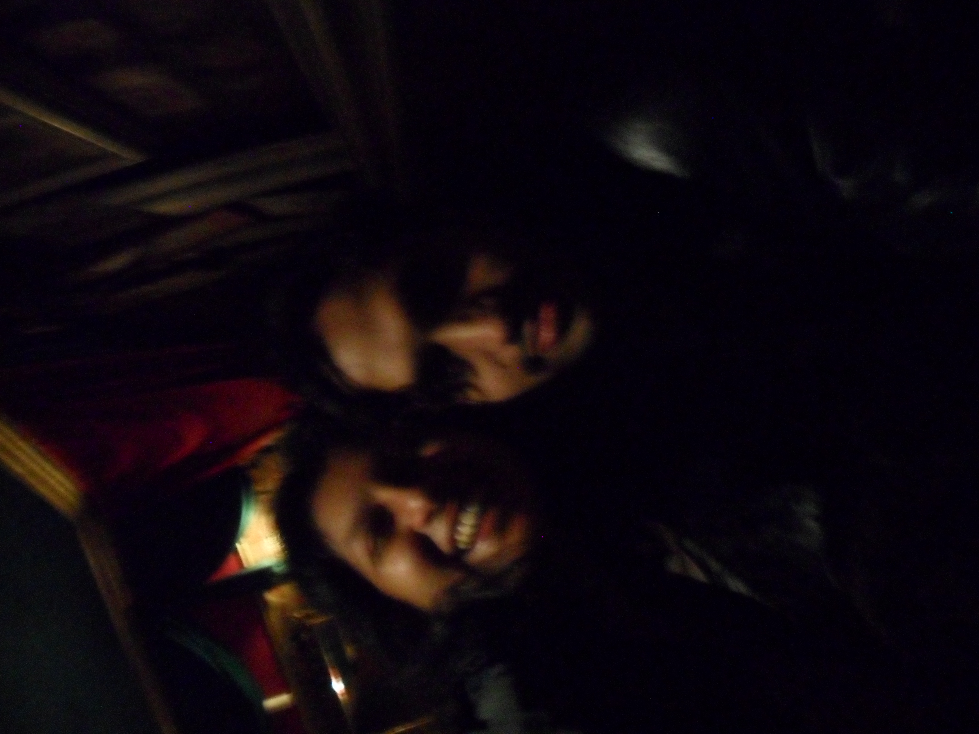 Two people in a darkish photo